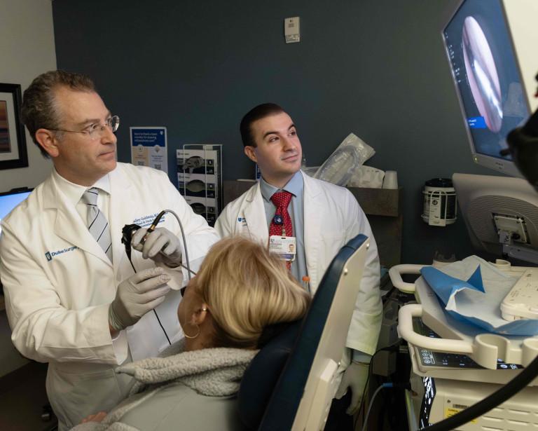 Brad Goldstein and Vincent D'Anniballe with a patient in the lab